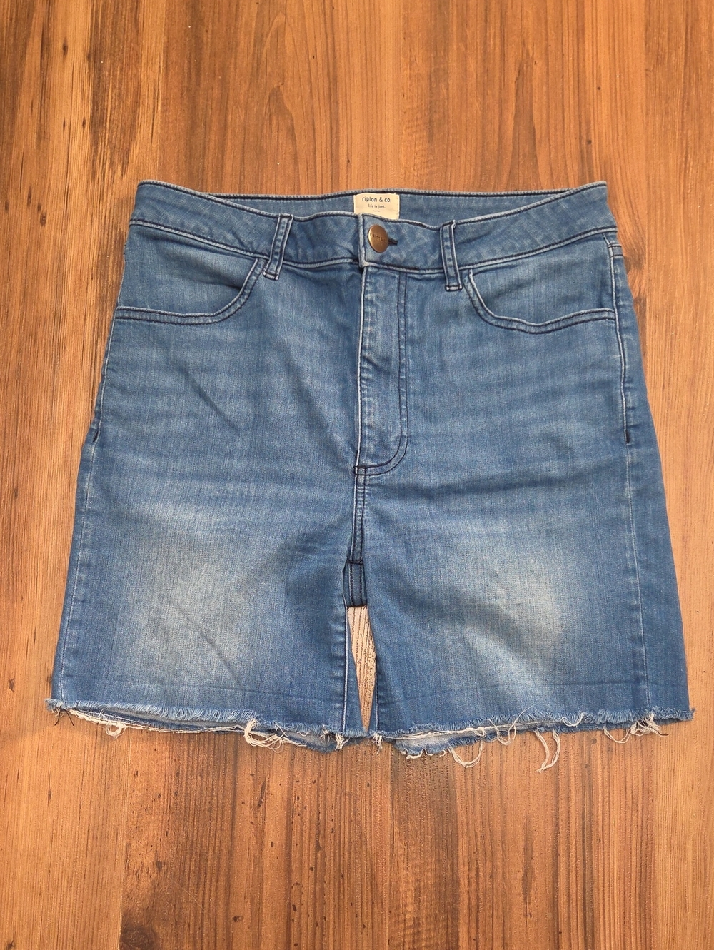 High-Rise Light Blue Denim Cutoff Shorts with Frayed Hem